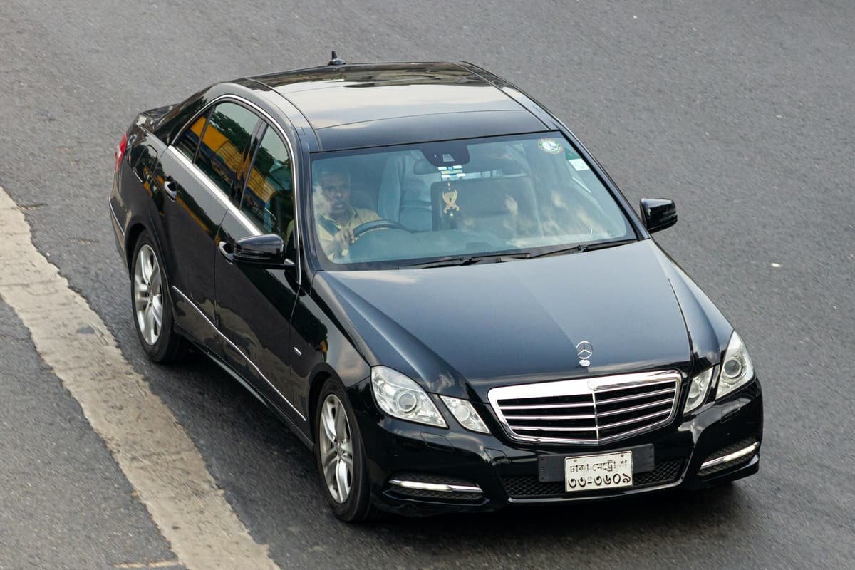 A black executive sedan parked