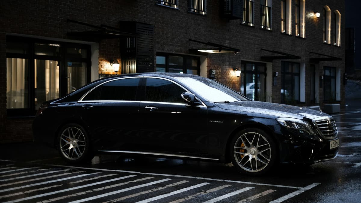 A black limousine in a street at night