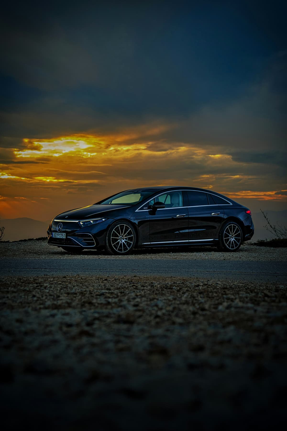 A premium electric sedan at sunset
