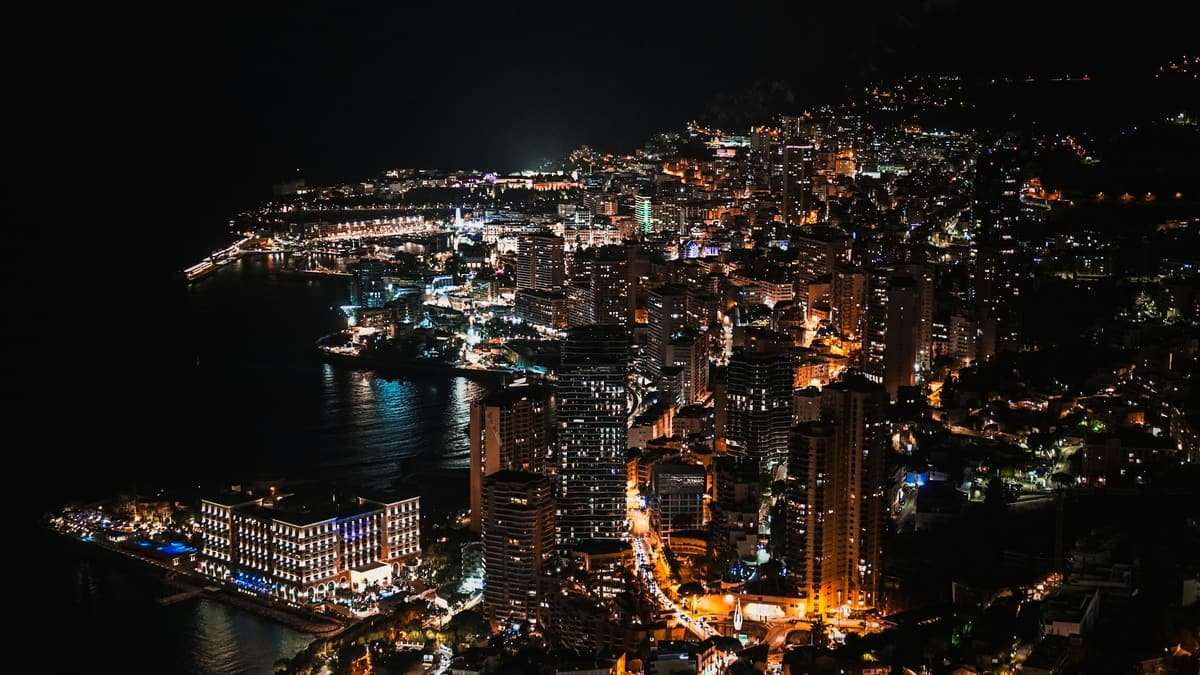 Monaco lit up at night, seen from the heights of the Principality