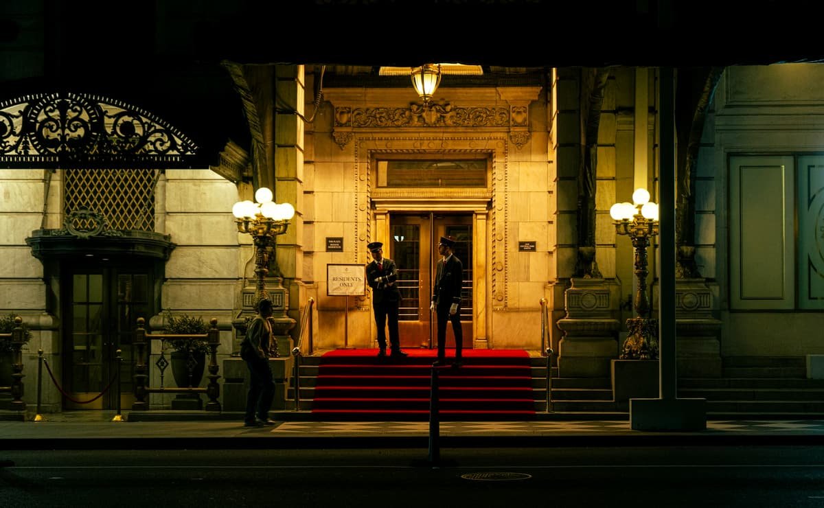 The lit entrance of a luxury hotel in the evening