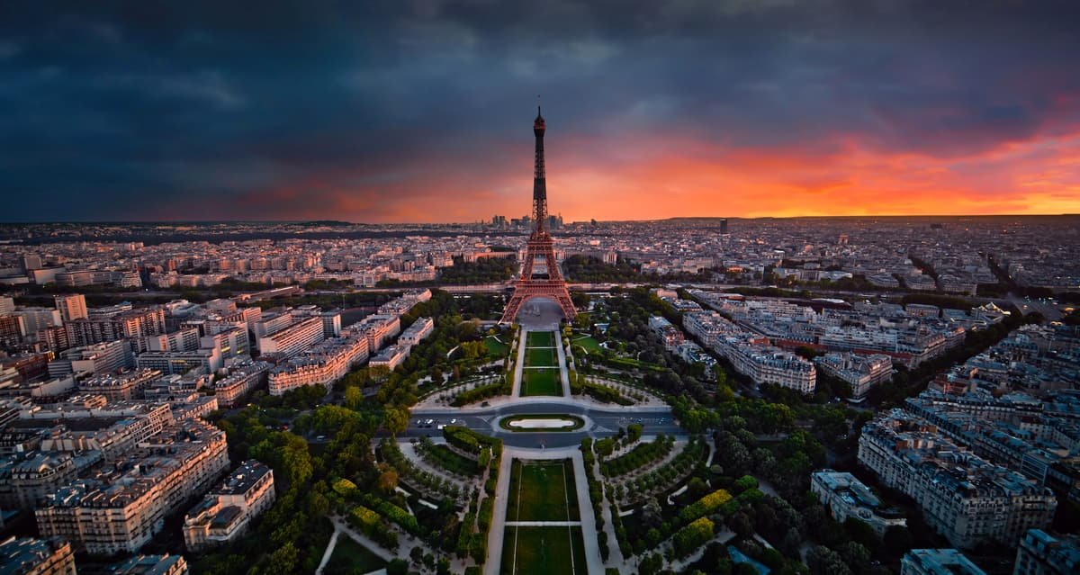 Paris at dusk, seen from the air, with the Eiffel Tower